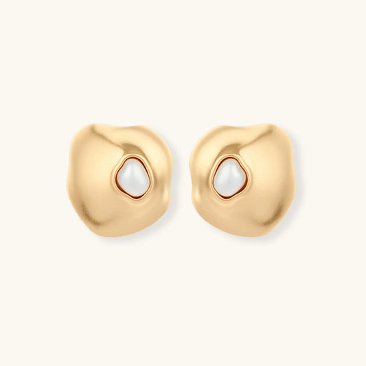 Organic-shaped eco-zinc alloy stud earrings with resin pearl centers and sterling silver posts on white background.