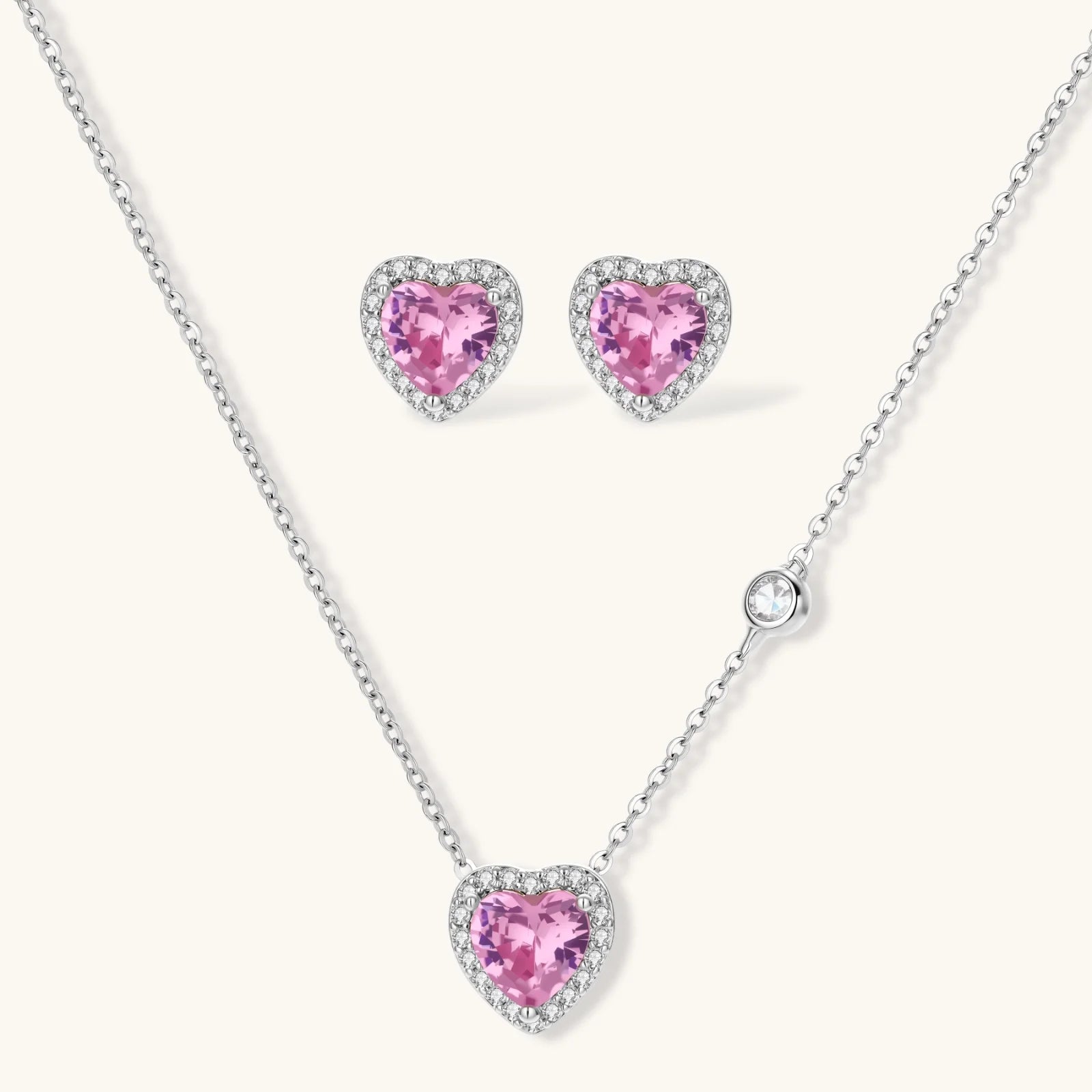 Pink heart-shaped cubic zirconia jewelry set with white gold plating featuring necklace, earrings, bracelet and ring