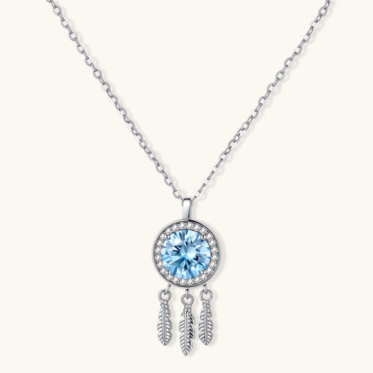Sterling silver dreamcatcher pendant with blue moissanite center and three feather charms on adjustable chain.