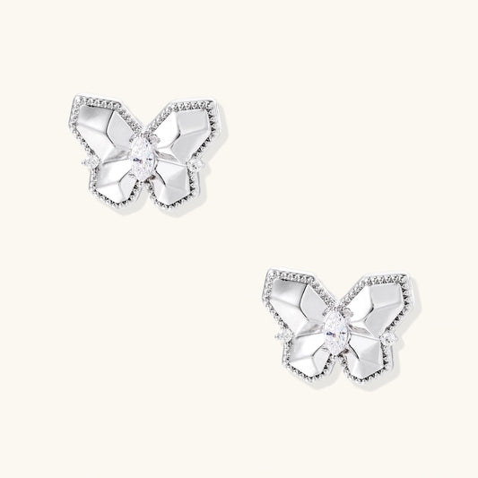 Silver butterfly stud earrings with marquise center stone and pavé crystal border on white background