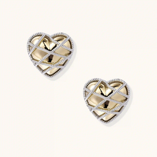 Heart-shaped stud earrings with intricate lattice design in 18K gold plated brass and silver-tone metal.