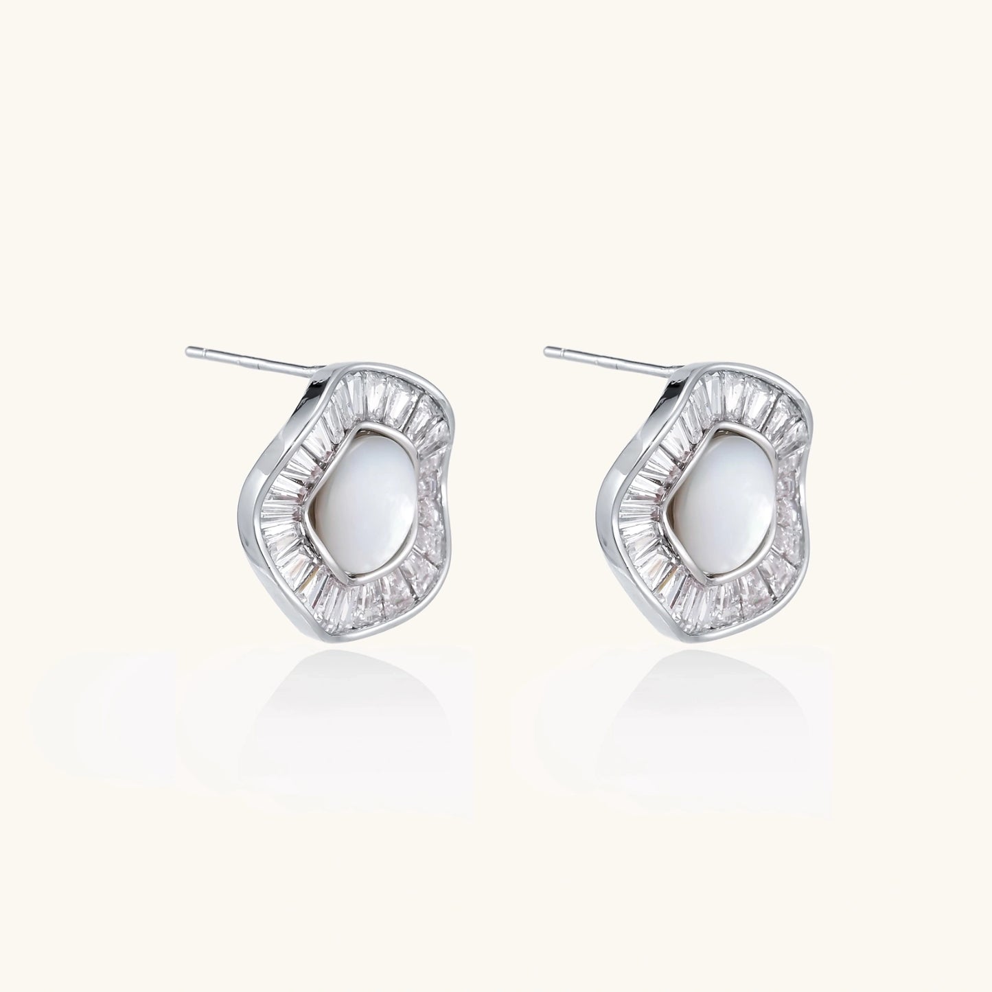 14K gold-plated stud earrings with freshwater pearl center surrounded by baguette-cut crystal halo in sunburst design