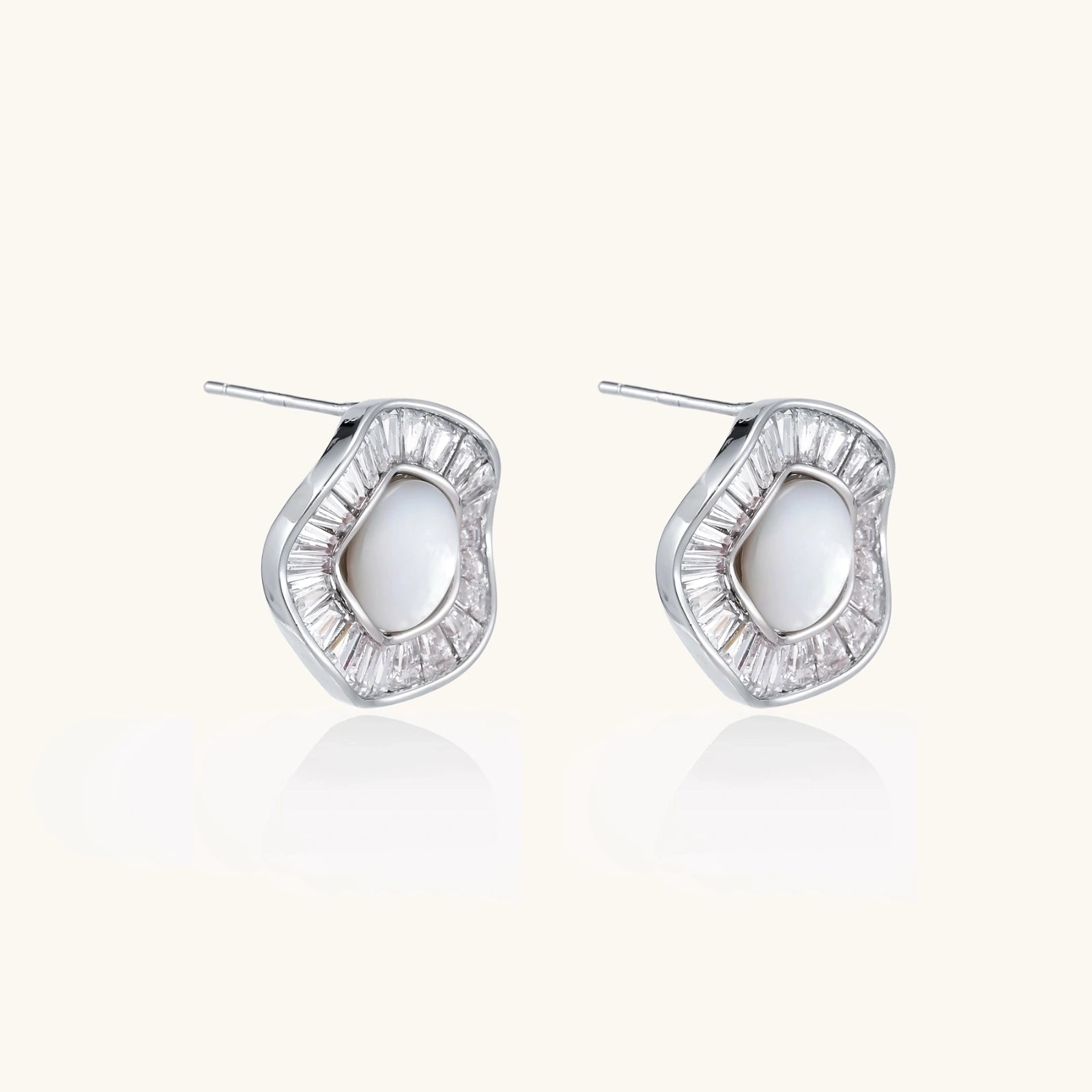 14K gold-plated stud earrings with freshwater pearl center surrounded by baguette-cut crystal halo in sunburst design