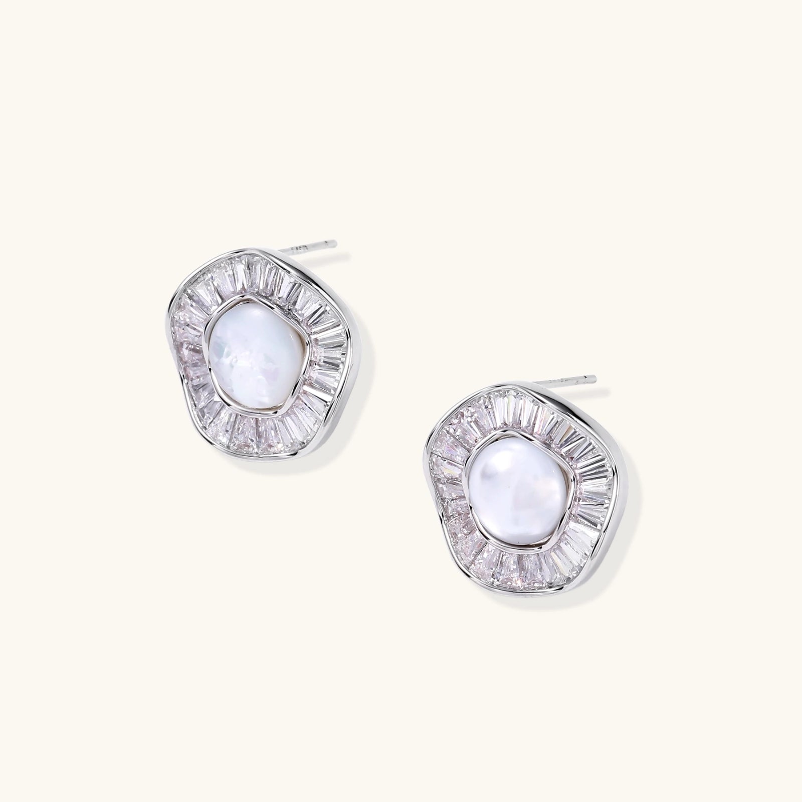 14K gold-plated stud earrings with freshwater pearl center surrounded by baguette-cut crystal halo in sunburst design